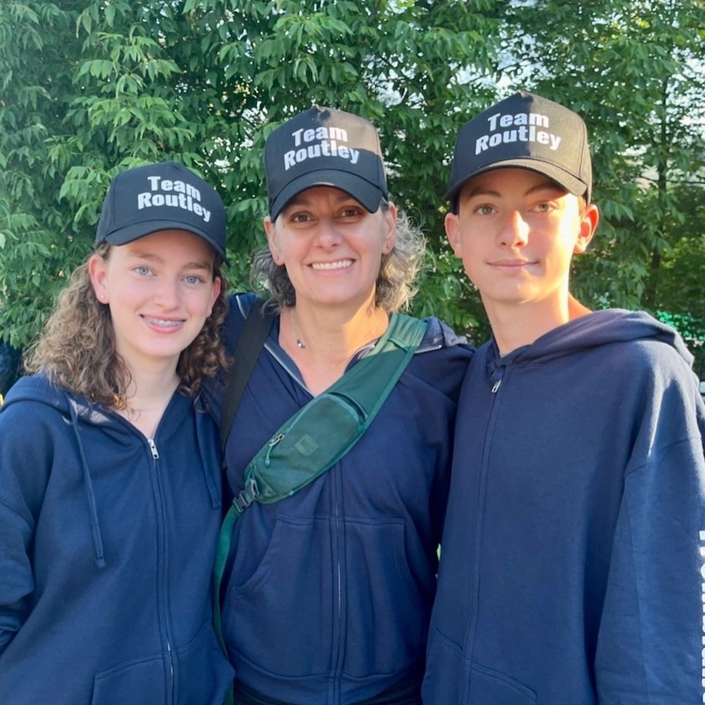 My wife, daughter, and son, wearing Team Routley hats at the race start