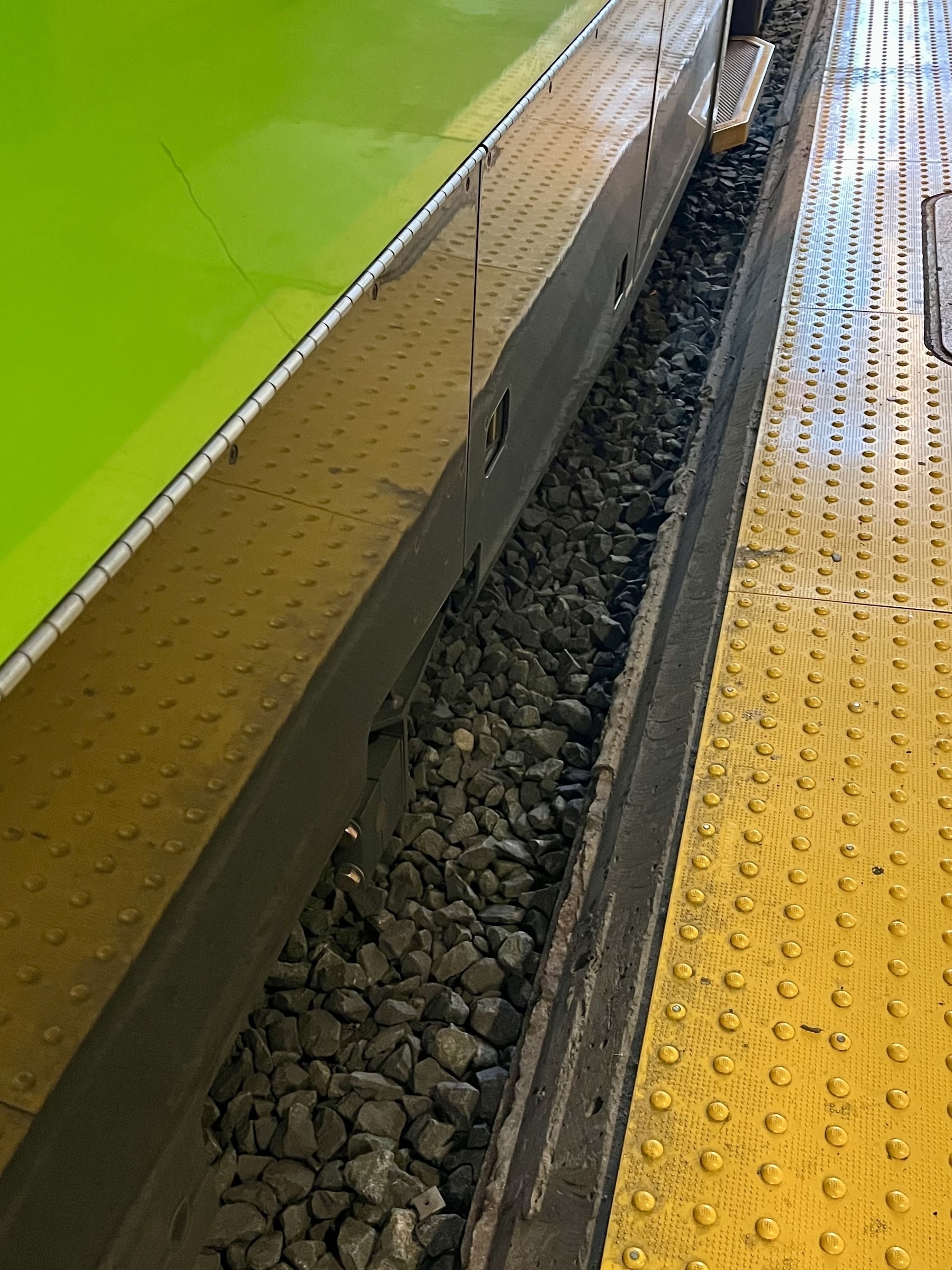 Edge of the train platform with yellow warning surface