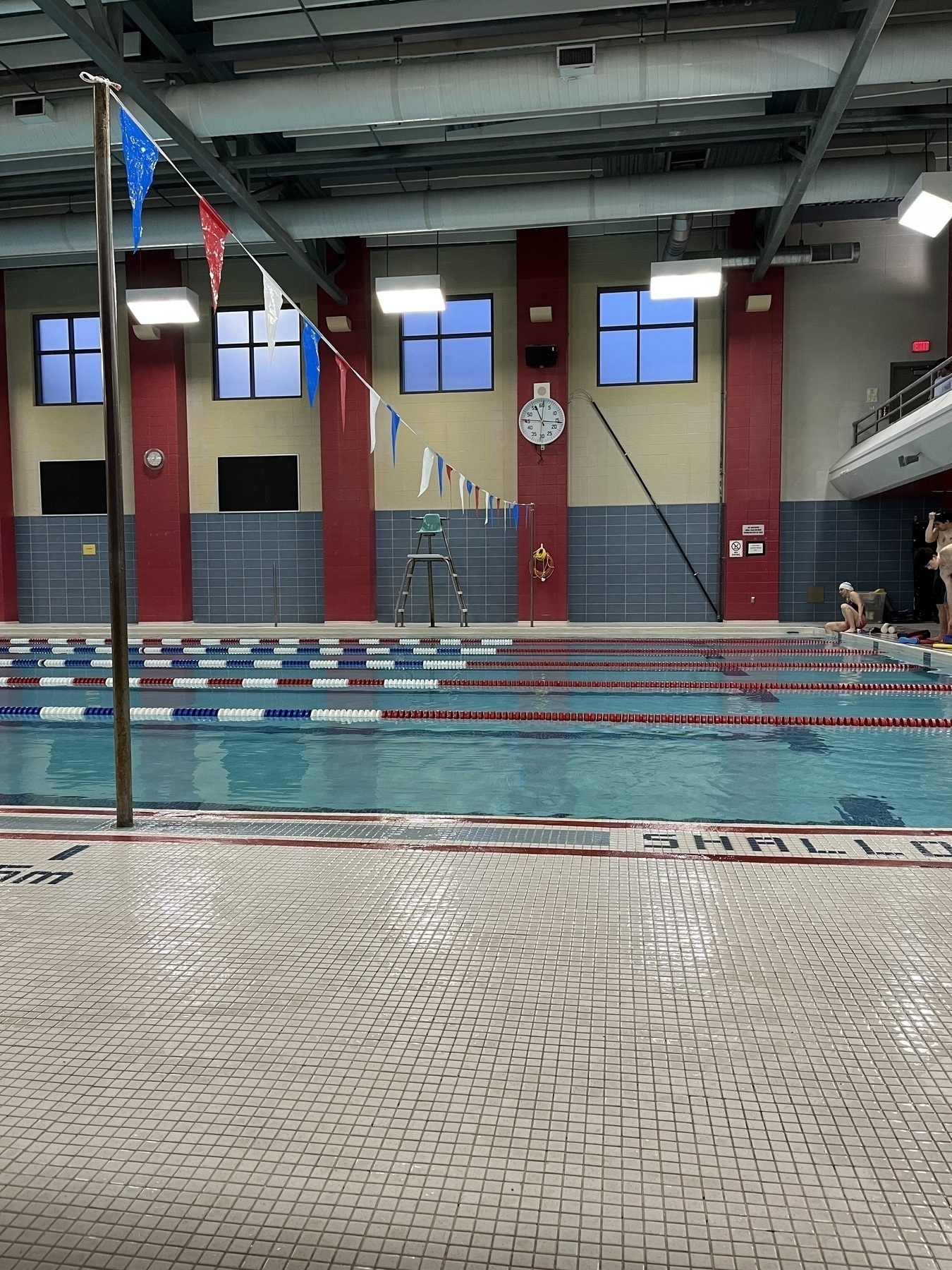 Swimming pool with lane markers and hanging turnaround flags 